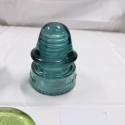 Lot 142: Antique Glass Telegraph/Telephone Insulators - Hemingray, Clear & Teal, 4pc + Token