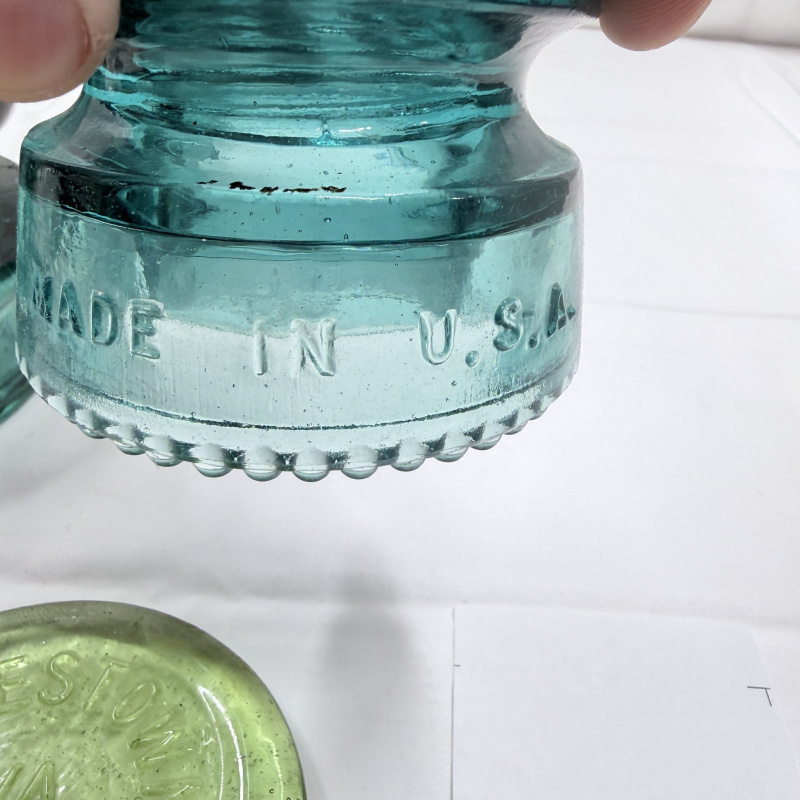 Lot 142: Antique Glass Telegraph/Telephone Insulators - Hemingray, Clear & Teal, 4pc + Token