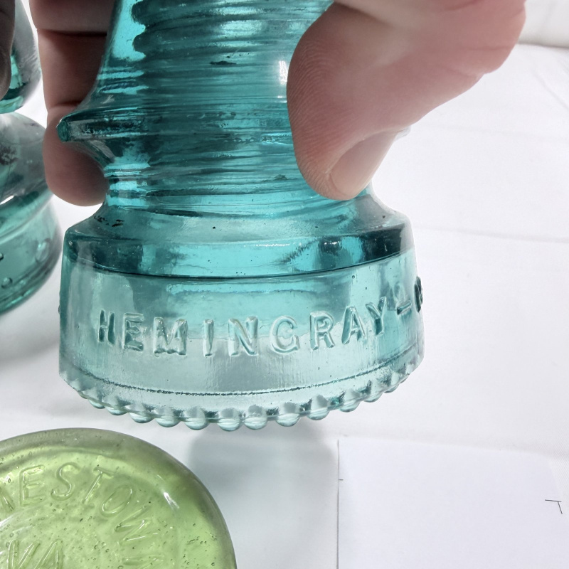 Lot 142: Antique Glass Telegraph/Telephone Insulators - Hemingray, Clear & Teal, 4pc + Token