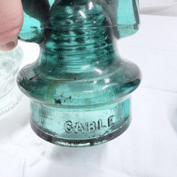 Lot 142: Antique Glass Telegraph/Telephone Insulators - Hemingray, Clear & Teal, 4pc + Token