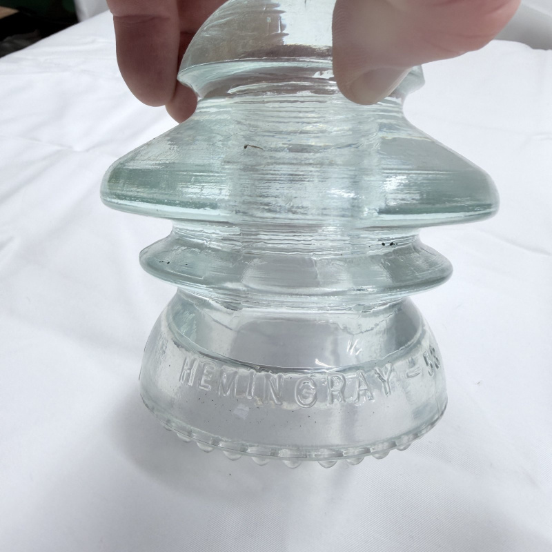 Lot 142: Antique Glass Telegraph/Telephone Insulators - Hemingray, Clear & Teal, 4pc + Token