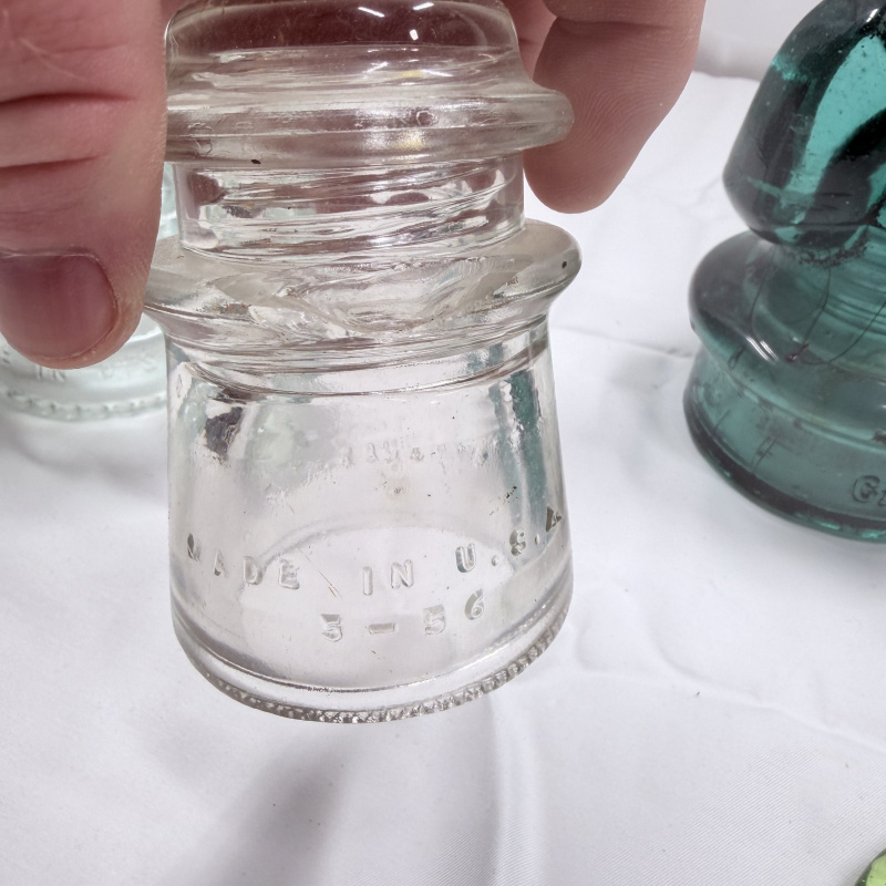 Lot 142: Antique Glass Telegraph/Telephone Insulators - Hemingray, Clear & Teal, 4pc + Token