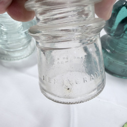 Lot 142: Antique Glass Telegraph/Telephone Insulators - Hemingray, Clear & Teal, 4pc + Token