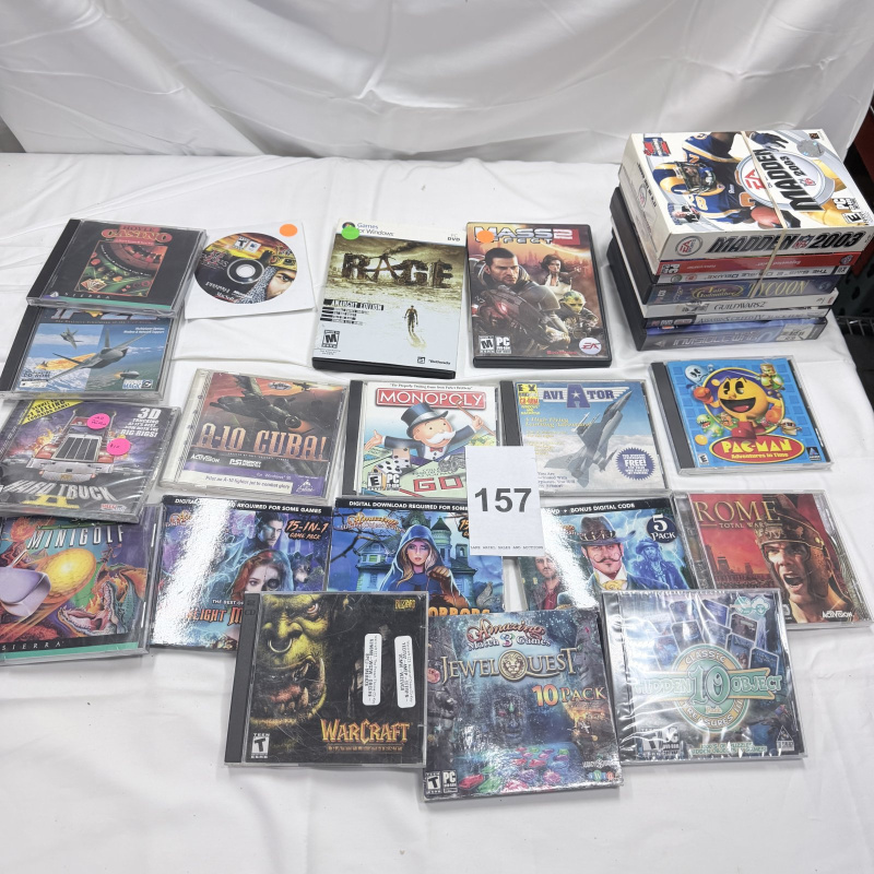 Lot 157: Assorted PC Video Game Collection 25+ Titles Madden 2003 Pac-Man Guild Wars 2