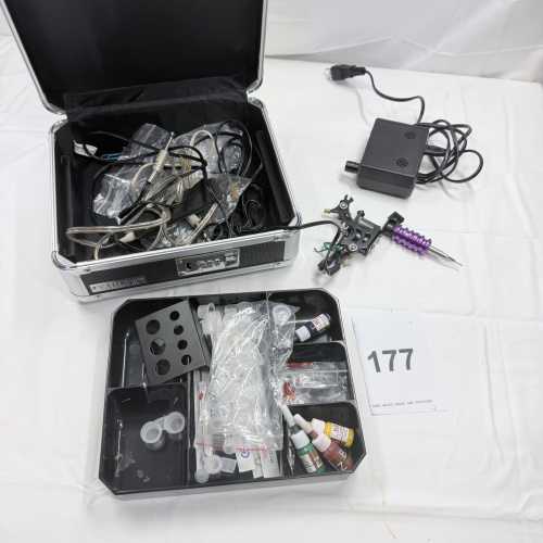 Lot 177: Tattoo Machine Kit with Power Supply, Inks, and Accessories in Case