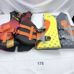 Lot 178: Life Jackets: Stearns Adult S/M Gray, Fluid Aquatics X-Small/Small U.S.C.G. Approved
