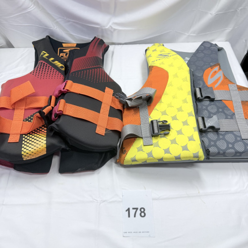 Lot 178: Life Jackets: Stearns Adult S/M Gray, Fluid Aquatics X-Small/Small U.S.C.G. Approved