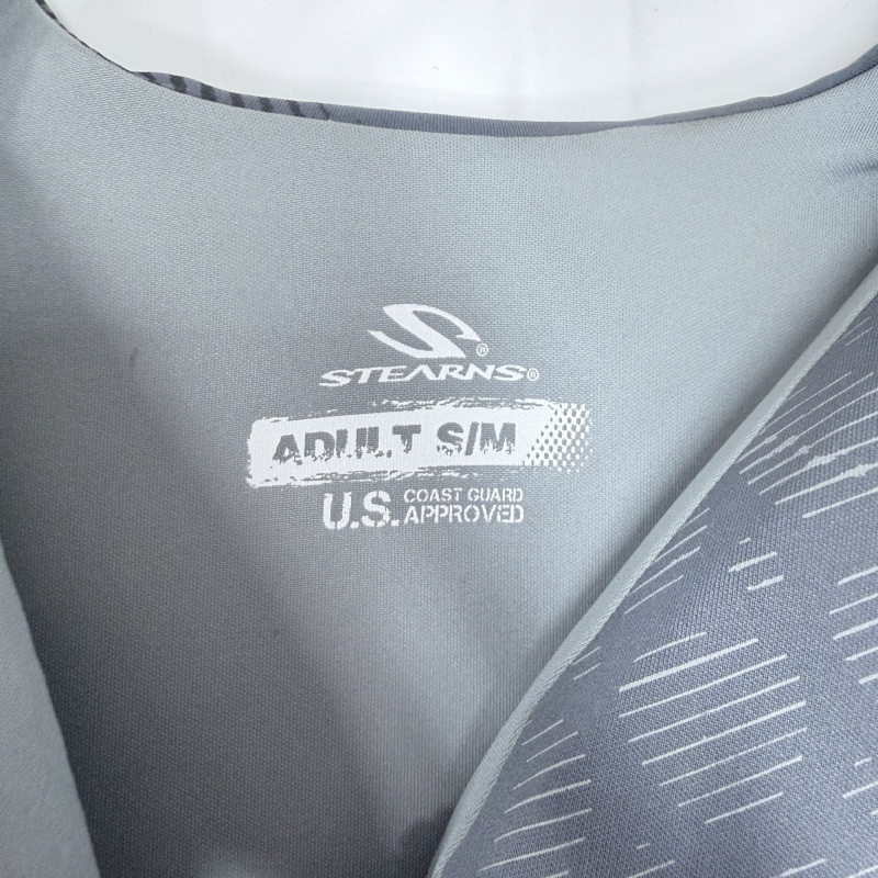 Lot 178: Life Jackets: Stearns Adult S/M Gray, Fluid Aquatics X-Small/Small U.S.C.G. Approved