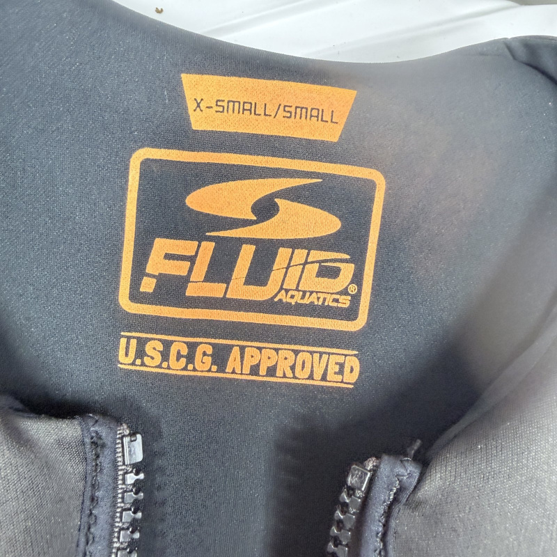Lot 178: Life Jackets: Stearns Adult S/M Gray, Fluid Aquatics X-Small/Small U.S.C.G. Approved