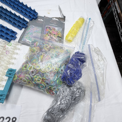 Lot 228: Rainbow Loom Rubber Bands & Clear Plastic C-Clips with Blue Storage Racks