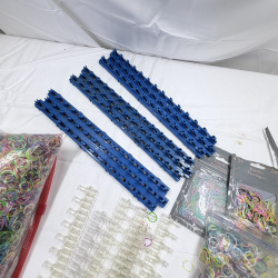 Lot 228: Rainbow Loom Rubber Bands & Clear Plastic C-Clips with Blue Storage Racks