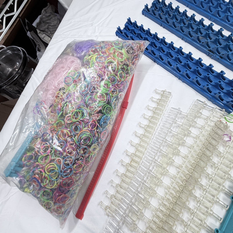 Lot 228: Rainbow Loom Rubber Bands & Clear Plastic C-Clips with Blue Storage Racks