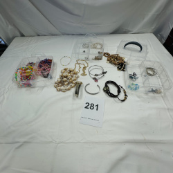 Lot 281: Clear Plastic Jewelry Organizer with Assorted Costume Jewelry Beads Necklaces