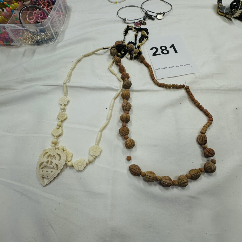 Lot 281: Clear Plastic Jewelry Organizer with Assorted Costume Jewelry Beads Necklaces