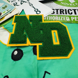 Lot 282: St. Patrick's Day Decorations Bundle - Banner, Window Clings, ND Patch, Shamrock Items