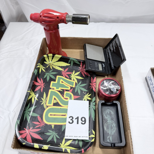 Lot 319: Red Butane Torch, Digital Scale, Metal Grinder, and 420 Rolling Tray Set