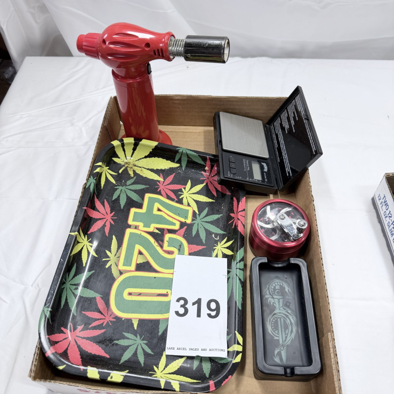 Lot 319: Red Butane Torch, Digital Scale, Metal Grinder, and 420 Rolling Tray Set