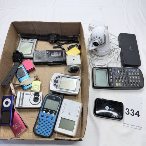Lot 334: Mixed Lot Vintage Electronics: Cameras, GPS, Calculator, MP3 Players, Walkie-Talkie