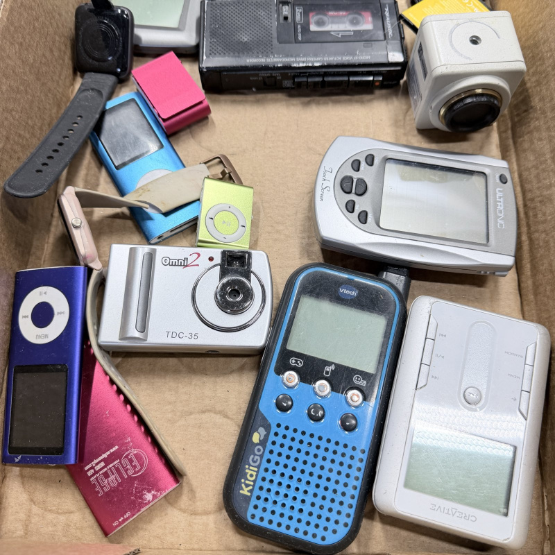 Lot 334: Mixed Lot Vintage Electronics: Cameras, GPS, Calculator, MP3 Players, Walkie-Talkie