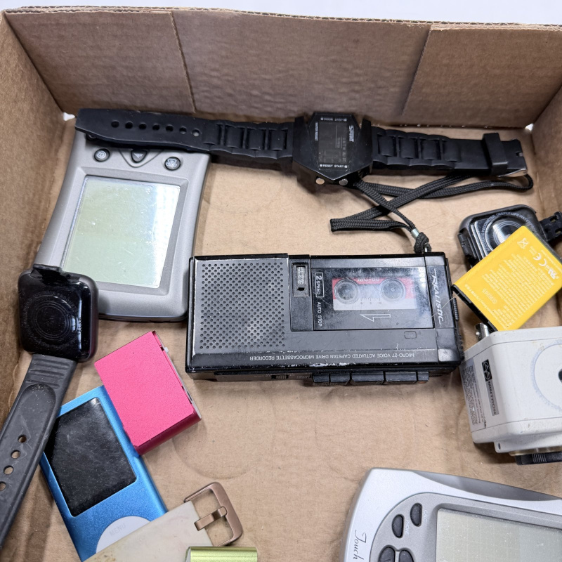 Lot 334: Mixed Lot Vintage Electronics: Cameras, GPS, Calculator, MP3 Players, Walkie-Talkie