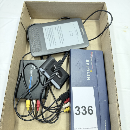 Lot 336: Amazon Kindle e-reader with NETGEAR router and cables