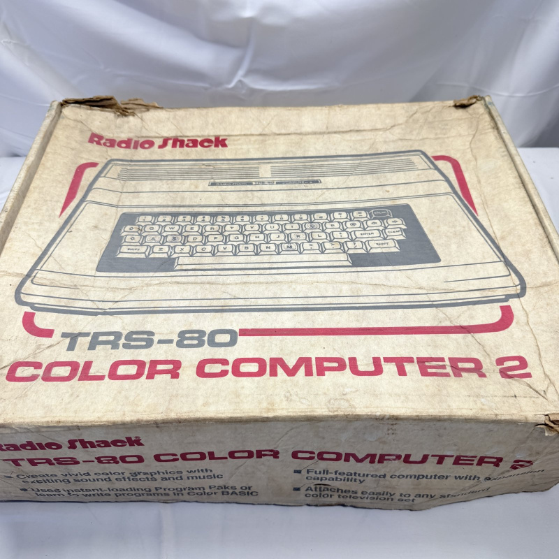 Lot 338: Radio Shack TRS-80 Color Computer 2 with Original Box, Games & Cassettes