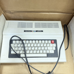 Lot 338: Radio Shack TRS-80 Color Computer 2 with Original Box, Games & Cassettes