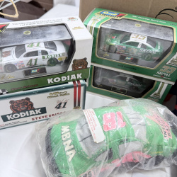 Lot 341: NASCAR Collectibles Lot - Die-Cast Cars, Plush Dolls, Photos, Interstate Batteries #18