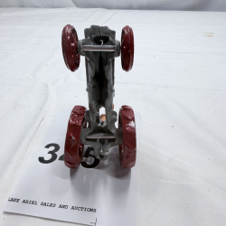 Lot 345: Die Cast Toy Tractor with Farmer Figure Gray & Red Metal