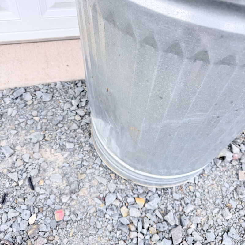 Lot 649: Vintage galvanized steel 20-gallon garbage can with lid, ribbed body and swing handles
