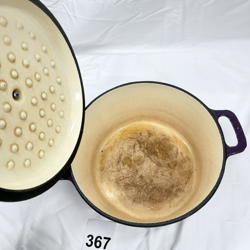 Lot 367: Bella purple enamel cast iron Dutch oven with lid, round covered casserole pot