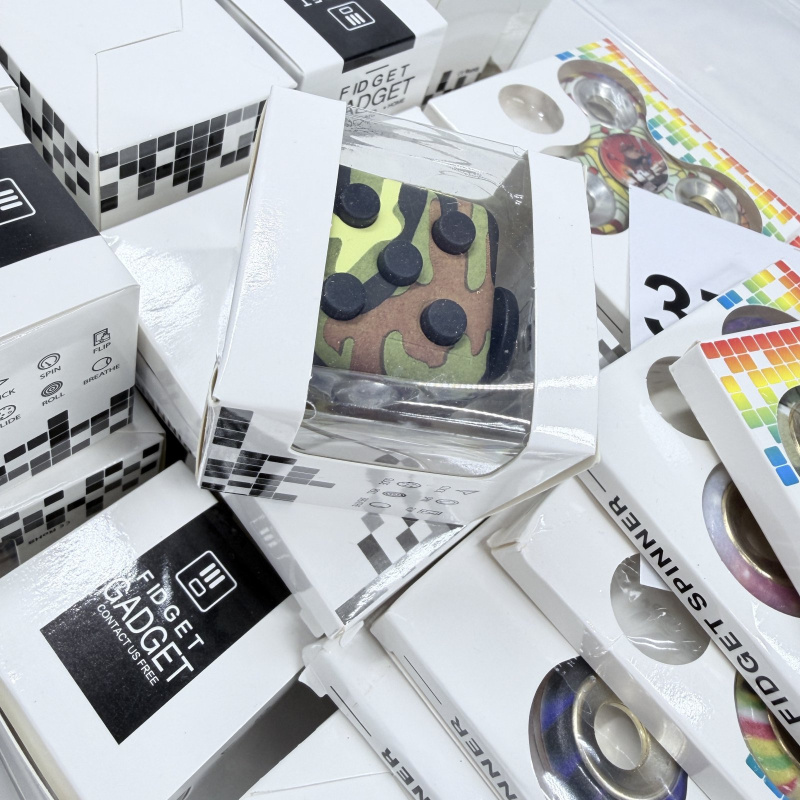 Lot 372: Fidget Gadget fidget spinner lot, assorted metal & camo bearing designs, boxed wholesale bulk