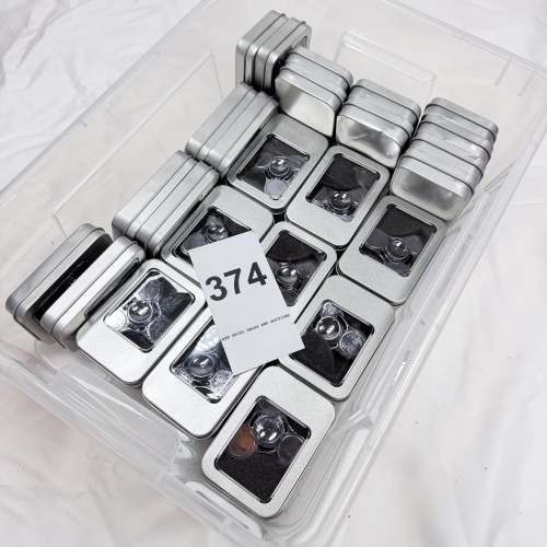 Lot 374: Fidget hand spinners in metal storage tins, lot of 34 pieces