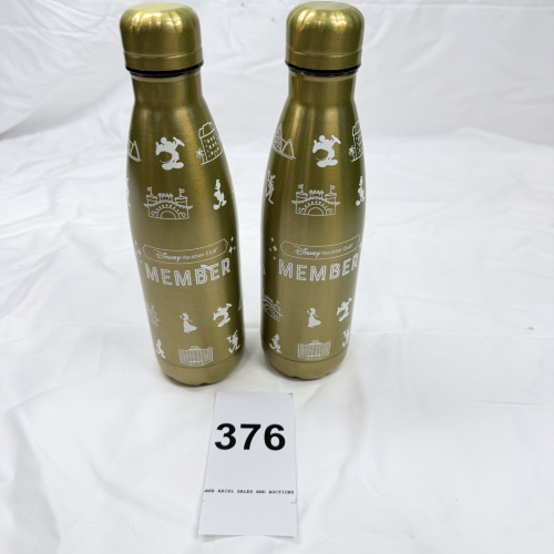 Lot 376: Disney Vacation Club Member gold stainless steel water bottles, set of 2, Parks icons design