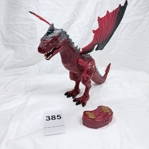 Lot 385: Red & black winged dragon dinosaur toy with light-up eyes and roar sound, remote control walking action figure
