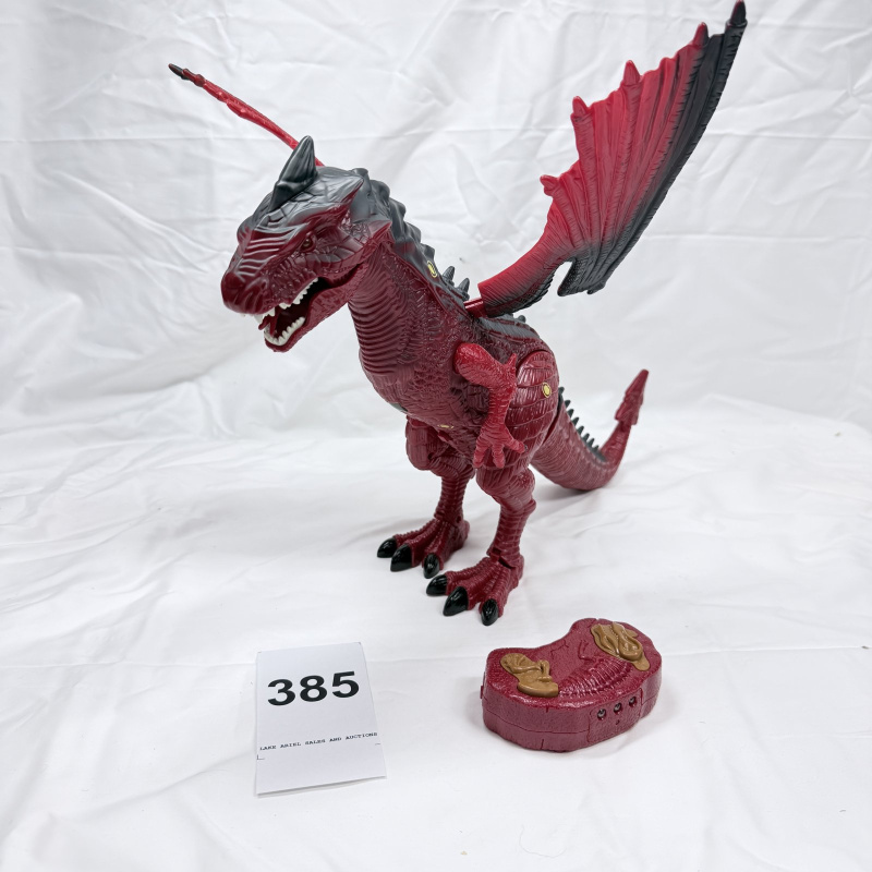 Lot 385: Red & black winged dragon dinosaur toy with light-up eyes and roar sound, remote control walking action figure