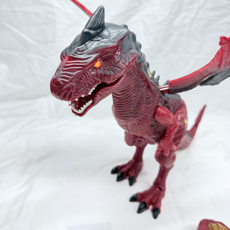 Lot 385: Red & black winged dragon dinosaur toy with light-up eyes and roar sound, remote control walking action figure