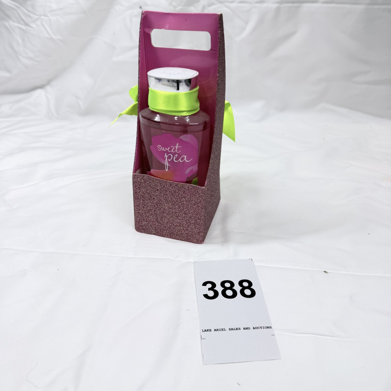 Lot 388: Sweet Pea fragrance body lotion gift set in glitter gift bag with ribbon