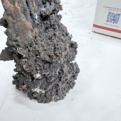 Lot 396: Fulgurite/melted copper wire cable mass with fused slag, lightning strike fulgurite specimen