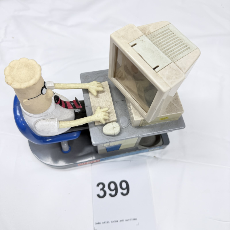Lot 399: 1990s Dilbert Electronic Candy Dispenser with M&M's, United Media desk figure