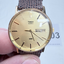 Lot 403: Vintage Timex Quartz men's wristwatch, gold-tone case with day/date, brown lizard-embossed leather strap