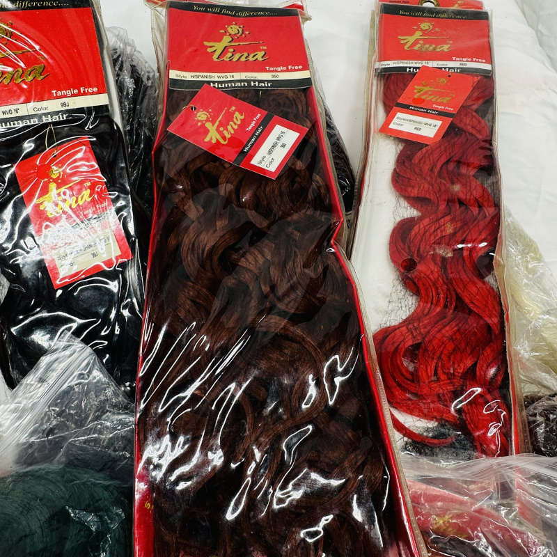 Lot 413: Large lot of Tina "Human Hair" & Janet Collections weave/wig extensions, mixed colors, Tangle Free series
