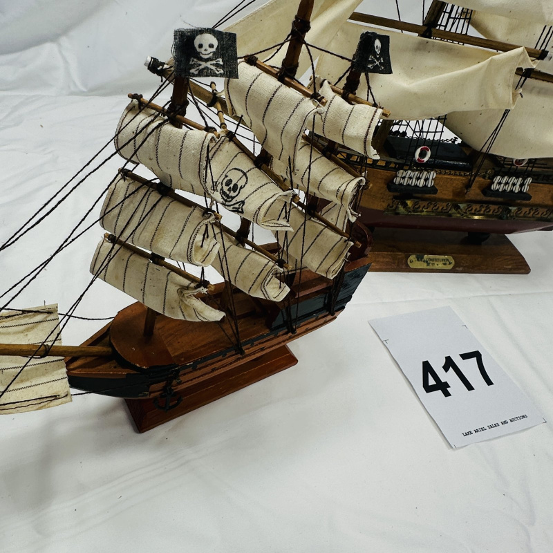 Lot 417: USS Constitution 1797 wooden tall ship model with wooden stand, plus small pirate galleon ship model, set of 2