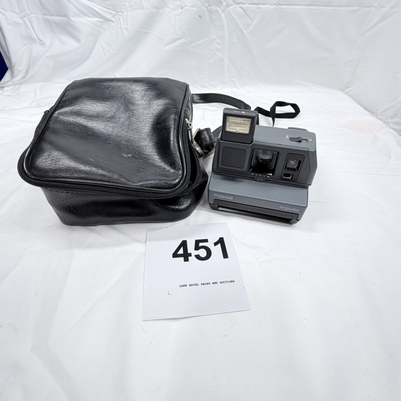 Lot 451: Vintage Polaroid Impulse instant camera with leather carrying case