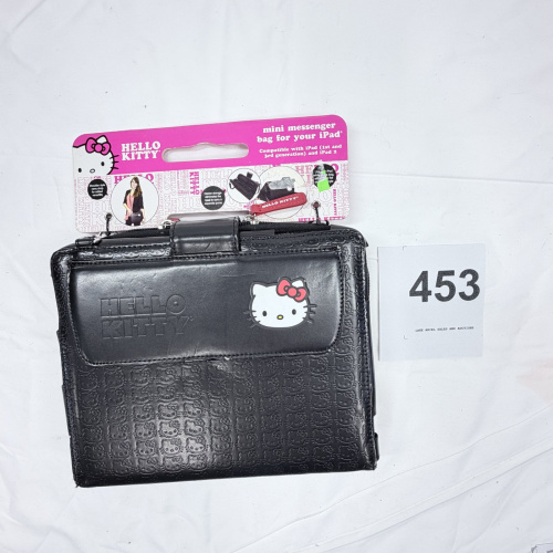 Lot 453: Hello Kitty faux-leather mini messenger bag for iPad (1st/3rd gen) and iPad 2, embossed logo, NIP with tags