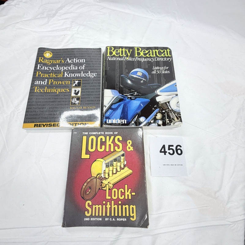 Lot 456: Vintage survivalist book lot: Ragnar Benson "Action Encyclopedia" Vol 1, Betty Bearcat Police Frequency Directory, and C.A. Roper "Locks & Lock-Smithing" 2nd Edition