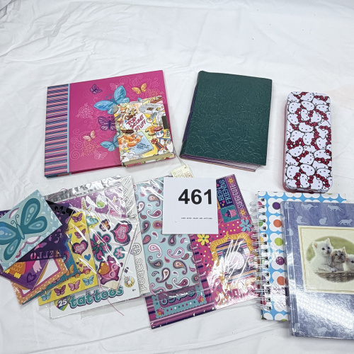Lot 461: Girls' diary and journal lot with Hello Kitty tin case, spiral notebooks, stickers and tattoo sheets