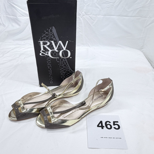 Lot 465: RW & Co. gold and pewter T-strap flat sandals, size 8.5, with box