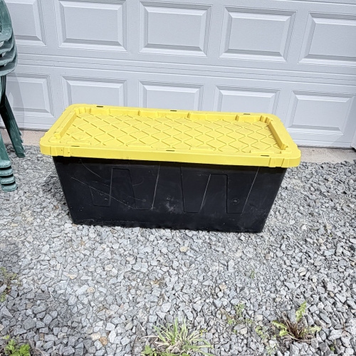 Lot 652: HDX "Tough Tote" 55 gallon storage container, black base with yellow lid, stackable/lockable