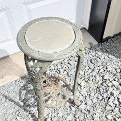 Lot 654: Vintage cast aluminum tri-leg plant stand with floral motif and stone/tile inset top, garden fern & flower design